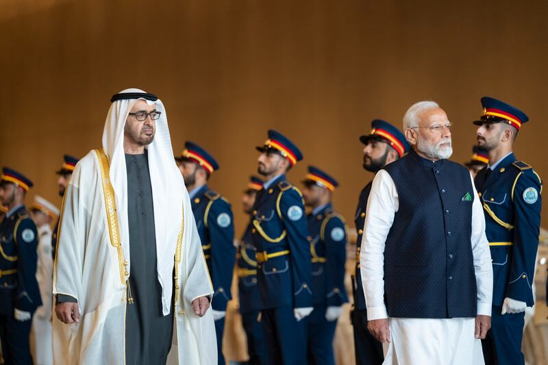 President Sheikh Mohamed and Narendra Modi, Prime Minister of India, inspect the UAE Armed Forces Honour Guard during a reception at the Presidential Airport on February 13. Abdulla Al Bedwawi / Presidential Court