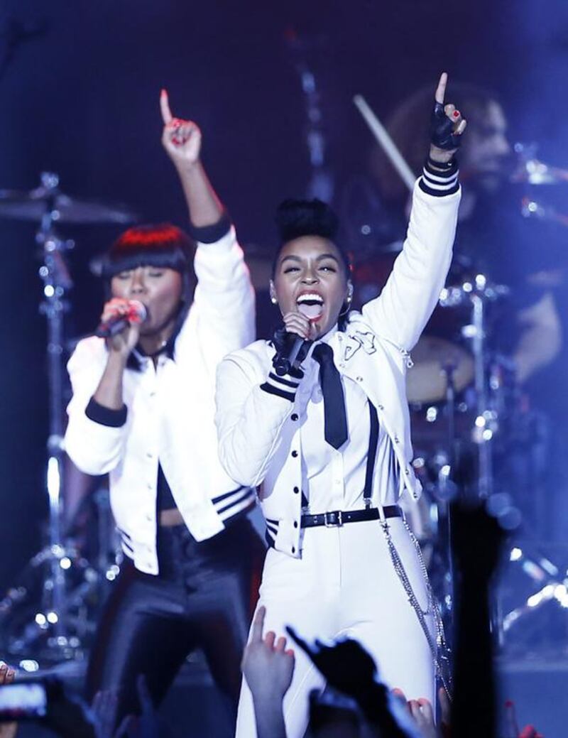 Singer Janelle Monae Robinson, right, performs during the 63rd NBA All-Star Game in New Orleans on February 16, 2014. Paul Buck / EPA