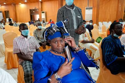 Mariam Sankara, widow of Thomas Sankara, sits in the courtroom where 14, including former president Blaise Compaore, are standing trial over his murder. AP