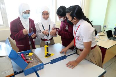 Pupils test their skills in a science lesson. Pawan Singh / The National