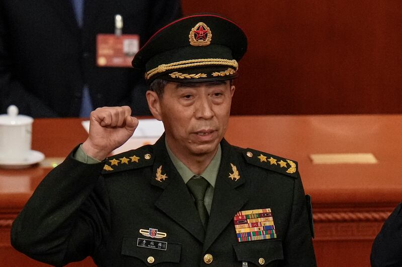 Chinese Defence Minister Gen Li Shangfu is sworn in during a session of China's National People's Congress in Beijing on March 12, 2023. AP