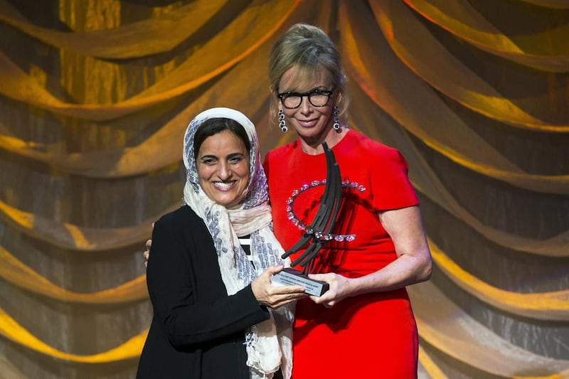Sheikha Lubna Al Qasimi, Minister for International Cooperation and Development, receives the Clinton Global Citizen award from Trudie Styler in New York on Sunday. Lucas Jackson / Reuters