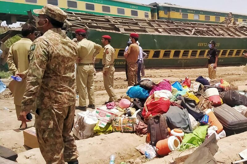 Security personnel at the site of a train accident in Ghotki, southern Pakistan, where at least 34 people were killed and dozens were injured when a packed Pakistani inter-city service hit a derailed train, officials said. AFP