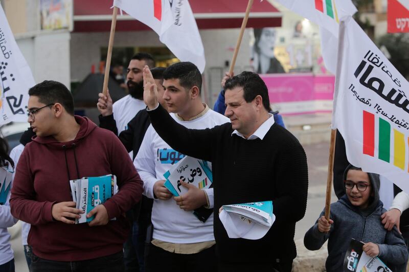 Ayman Odeh, Israeli Arab parliament member and leader of the Joint List alliance, waves to supporters during an election campaign event in then town of Yabeh, West Bank. AP