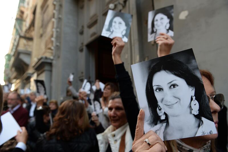 (FILES) In this file photo taken on April 16, 2018 people leave the church of St Francis, after the Archbishop of Malta celebrated mass in memory of murdered journalist Daphne Caruana Galizia on the sixth month anniversary of her death in Valletta, Malta.  Malta police on November 20, 2019 arrested a businessman in connection with the 2017 murder of investigative journalist and blogger Daphne Caruana Galizia, a police source told AFP. Maltese national Yorgen Fenech was detained on his yacht at dawn as he tried to leave Malta the day after an alleged middleman was offered a pardon if he identified the assassination's mastermind, the source said.
 / AFP / Matthew Mirabelli
