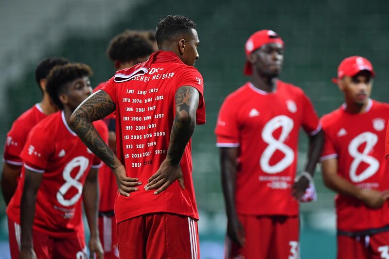 Jerome Boateng of Bayern Munich wears a t-shirt in celebration of securing the Bundesliga title. EPA