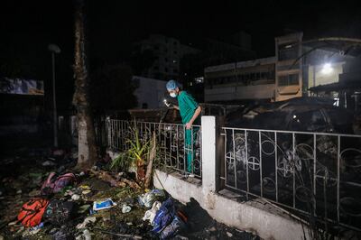 Palestinian doctors search for bodies and survivors in the rubble of Al Ahli hospital after a reported air strike in Gaza City on Tuesday. EPA