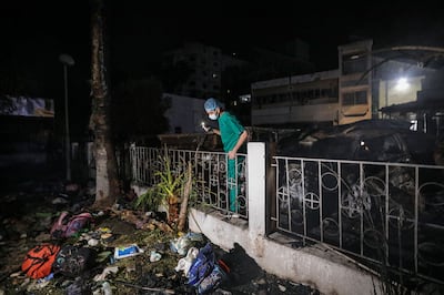 Palestinian doctors search for bodies and survivors in the rubble of Al Ahli hospital after a reported air strike in Gaza City on Tuesday. EPA