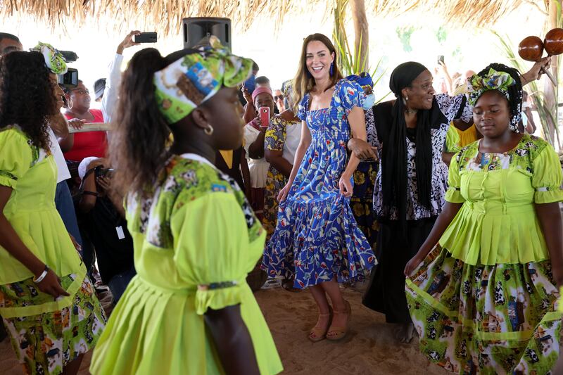 Kate, Duchess of Cambridge dances while attending the Festival of Garifuna Culture in Hopkins, Belize.