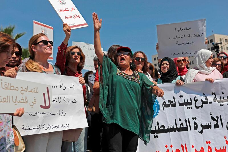 Palestinian women protest in support of women’s rights outside the prime minister’s office in the West Bank city of Ramallah on September 2, 2019, after a young Palestinian died in a case that has raised emotions.  Israa Gharib died last week in disputed circumstances – many Palestinians have accused her family of beating her to death after posting a picture online with a boy, though the family have denied the claim. 
 / AFP / ABBAS MOMANI
