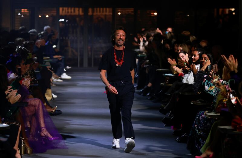Designer Pierpaolo Piccioli appears at the end of his spring/summer 2022 women's ready-to-wear collection show. Reuters