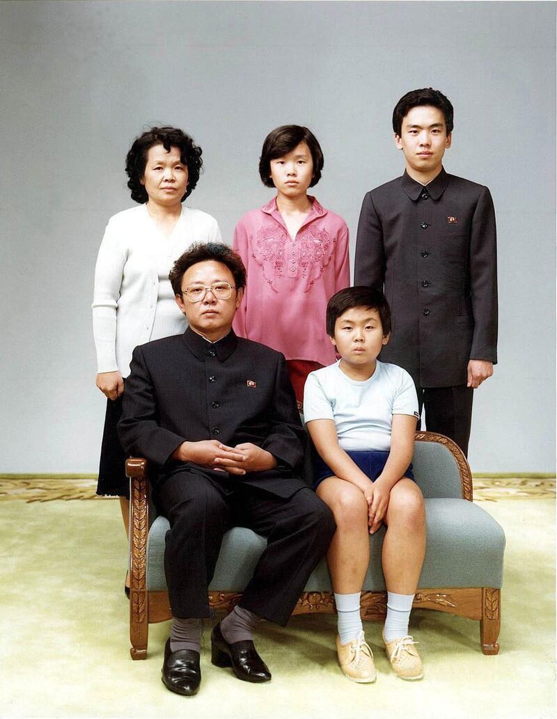 (FILES) This photo taken 19 August 1981 and recently released shows North Korean leader Kim Jong-Il (sitting-L) sitting with his son, Jong-Nam (sitting-R), Kim's sister-in-law Sung Hye-Rang (L-top), Sung's daughter Lee Nam-Ok (C-top) and son Lee Il-Nam (R-top).  North Korean leader Kim Jong-Il died on December 17, 2011: Pyongyang's state TV said on December 19, 2011.  KOREA OUT    AFP PHOTO
 *** Local Caption ***  501070-01-08.jpg