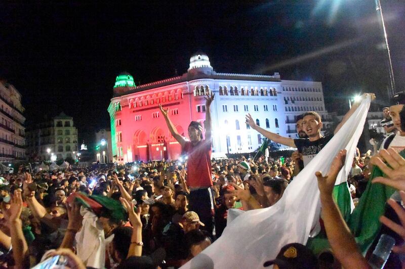 Algeria supporters celebrate after beating Nigeria on the Grande Poste place in Algiers. AFP