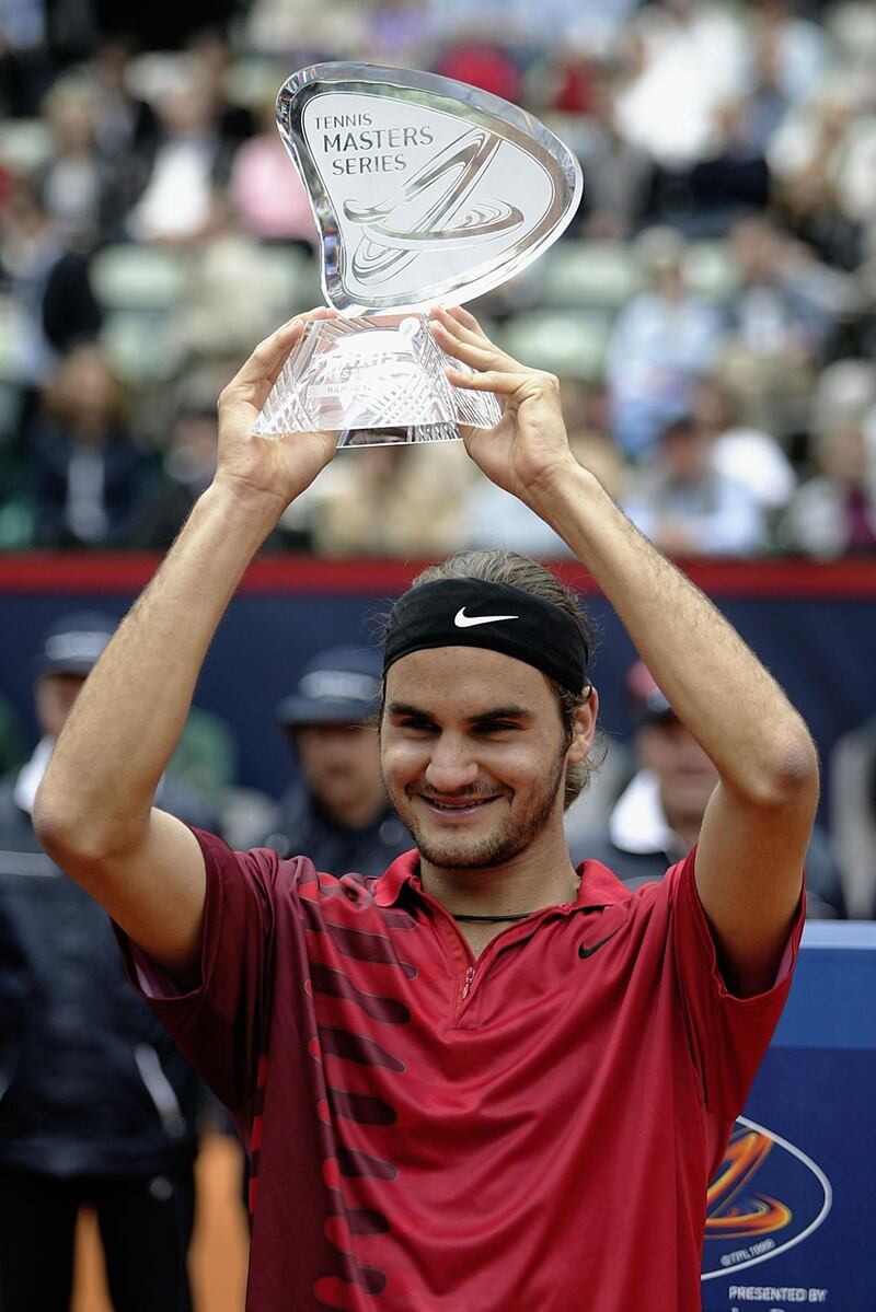 HAMBURG, GERMANY -19 MAY:  Roger Federer of Switzerland holds aloft the trophy after defeating Marat Safin of Russia in the Final during the ATP Tennis Masters Series at the Rothenbaum Tennis Centre in Hamburg in Germany on May 19, 2002.  (Photo by Michael Steele/Getty Images)