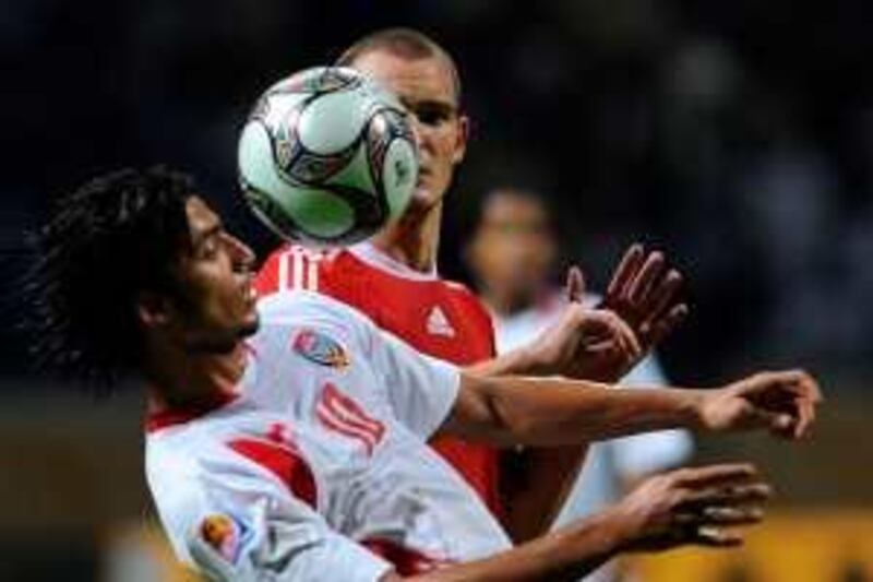 Emirati player Theyab Awana (front) vies for the ball with Hungary's Adam Simon during their FIFA U-20 World Cup Group F football match in the Egyptian port city of Alexandria on October 3, 2009. Hungary won the match 2-0. AFP PHOTO/KHALED DESOUKI