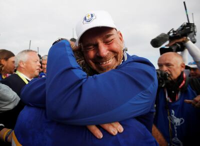 Golf - 2018 Ryder Cup at Le Golf National - Guyancourt, France - September 30, 2018. Team Europe's Francesco Molinari celebrates with captain Thomas Bjorn after winning the Ryder Cup REUTERS/Carl Recine      TPX IMAGES OF THE DAY