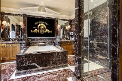 The marble-clad main bathroom has its own TV. Park Lane Mansion. Photo: Wetherell / Darran Mulcahy Photography