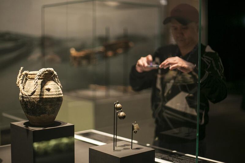 A glazed jar and bells at the launch of the Qasr Al Hosn 2018 master plan for the development of the fort. Mona Al Marzooqi / The National