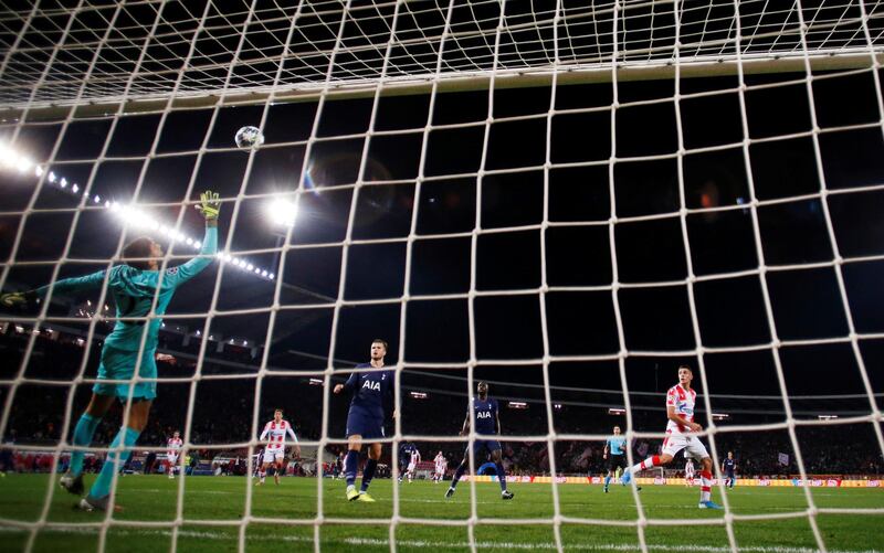 The ball deflects off Tottenham Hotspur's Davinson Sanchez and hits the crossbar after a shot from Rajiv van La Parra of Red Star Belgrade. Reuters