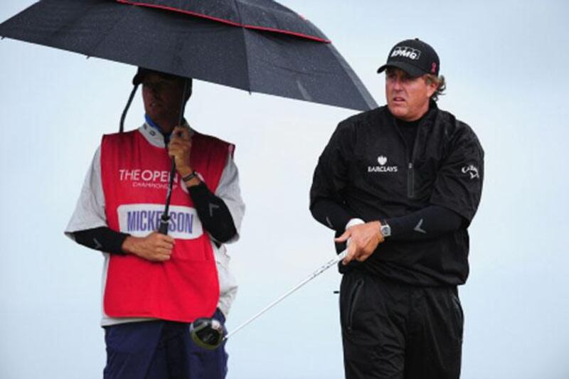 SANDWICH, ENGLAND - JULY 17:  Phil Mickelson of the United States and his caddie Jim Mackay on the 12th tee during the final round of The 140th Open Championship at Royal St George's on July 17, 2011 in Sandwich, England.  (Photo by Stuart Franklin/Getty Images)