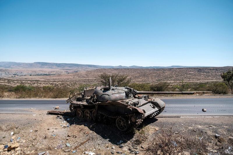 (FILES) In this file photo taken on February 26, 2021 A damaged tank stands on a road north of Mekele, the capital of Tigray on February 26, 2021. The United States voiced concern on March 2, 2021 over the arrests by Ethiopian authorities of four media workers in the conflict-hit northern Tigray region, saying the move was inconsistent with the government's commitments.
 / AFP / EDUARDO SOTERAS
