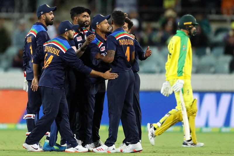 T Natarajan of India celebrates with his team after taking the wicket of Ashton Agar in the third ODI against Australia. Getty