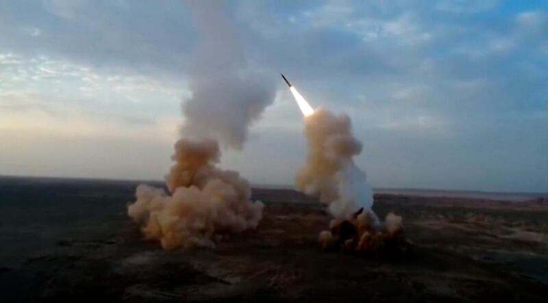 This video grab shows launching underground ballistic missiles by the Iranian Revolutionary Guard during a military exercise. Iran's paramilitary Revolutionary Guard launched underground ballistic missiles as part of an exercise involving a mock-up aircraft carrier in the Strait of Hormuz, state television reported Wednesday. (IRGC via AP)