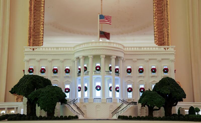 A gingerbread White House adorns the State Dining Room during a holiday decoration press preview at the White House in Washington, DC on November 30, 2020. Reuters