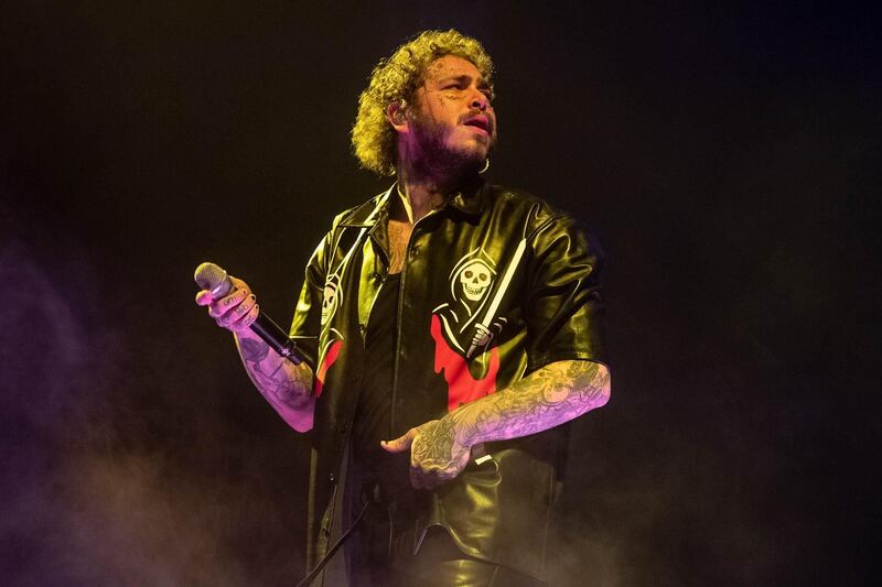 INGLEWOOD, CALIFORNIA - NOVEMBER 20: Post Malone performs onstage at The Forum on November 20, 2019 in Inglewood, California.   Emma McIntyre/Getty Images/AFP
== FOR NEWSPAPERS, INTERNET, TELCOS & TELEVISION USE ONLY ==
