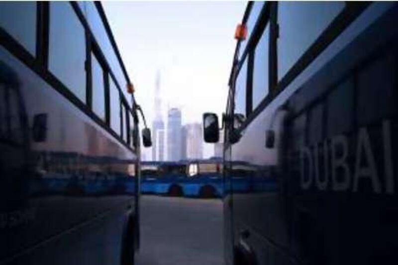 DUBAI-AUGUST 27,2008 - School bus parked at Dubai Modern High School  in Dubai . (Paulo Vecina/The National ).  *** Local Caption ***  PV Bus4.JPG