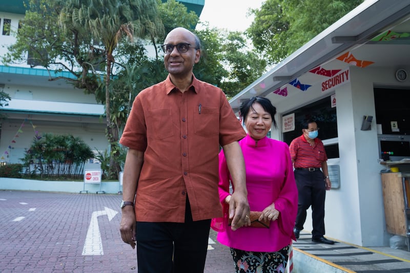 Tharman Shanmugaratnam, president-elect, and his wife Jane Yumiko Ittogi leave a polling station during the presidential election in Singapore. Bloomberg