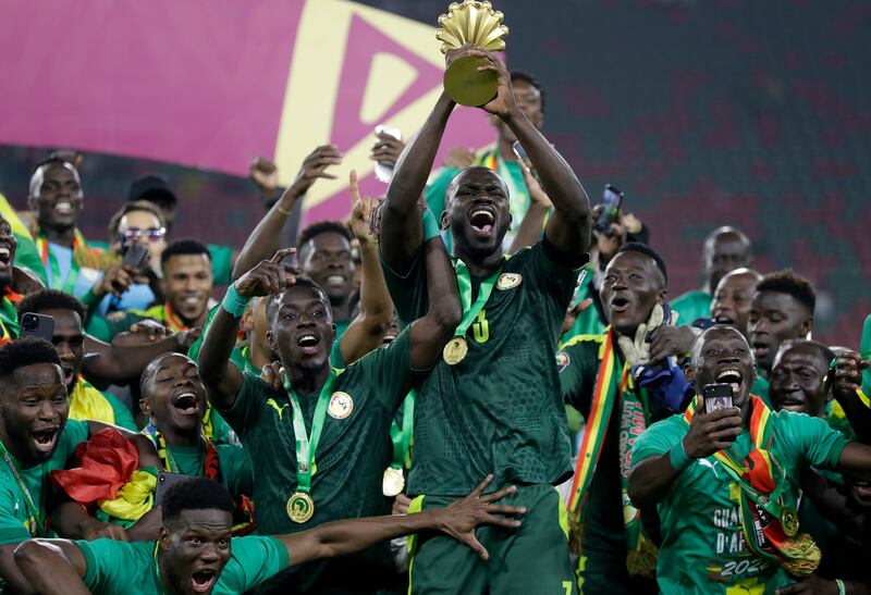 Senegal players celebrate winning the African Cup of Nations 2022. AP