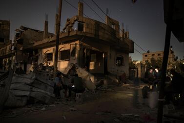 Palestinians spend the night next to their destroyed homes that were hit recently by Israeli air strikes in town of Beit Hanoun, northern Gaza. AP