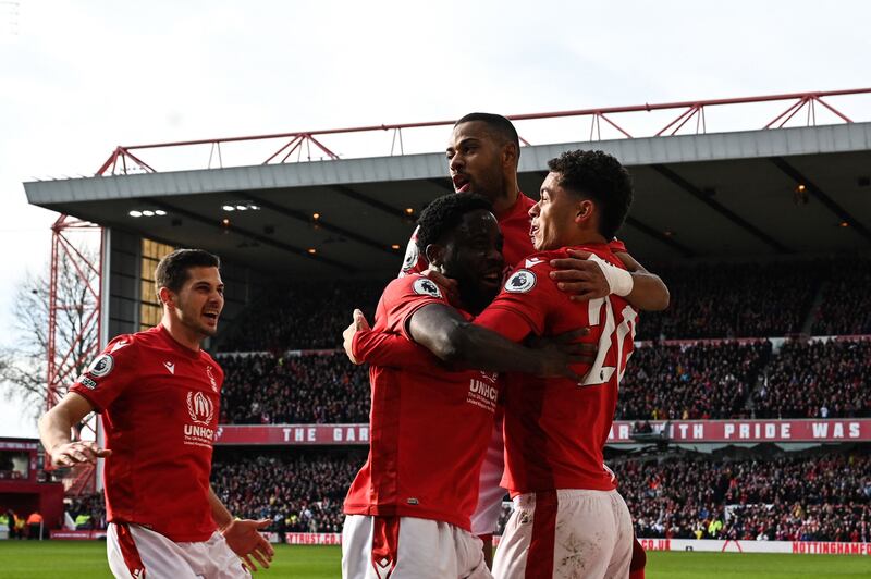 Brennan Johnson celebrates his goal with his Nottingham Forest teammates. AFP