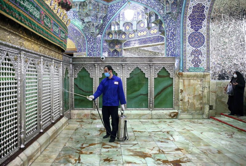 An Iranian sanitary worker disinfects Qom's Masumeh shrine on February 25, 2020 to prevent the spread of the coronavirus which reached Iran, where there were concerns the situation might be worse than officially acknowledged. - The deaths from the disease -- officially known as COVID-19 -- in the Islamic republic were the first in the Middle East and the country's toll with so far a dozen people officially reported dead, is now the highest outside mainland China, the epidemic's epicentre. (Photo by MEHDI MARIZAD / FARS NEWS AGENCY / AFP)