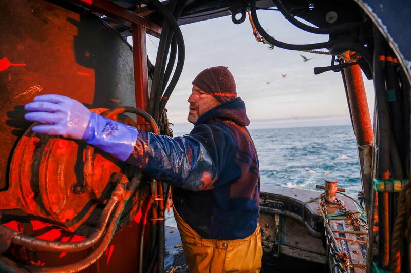 A fisherman works aboard fishing boat 'About Time' while trawling in the English Channel from the Port of Newhaven, East Sussex, U.K. on Sunday, Jan. 10, 2021. While Prime Minister Boris Johnson claimed last month’s trade deal will let the U.K. regain control of its fishing waters by taking back 25% of the European Union’s rights over five years, many fishermen feel let down. Photographer: Jason Alden/Bloomberg