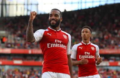 Arsneal's Alexandre Lacazette celebrates scoring his side's first goal of the game during the Emirates Cup match at the Emirates Stadium, London. PRESS ASSOCIATION Photo. Picture date: Sunday July 30, 2017. See PA story SOCCER Arsenal. Photo credit should read: John Walton/PA Wire. RESTRICTIONS: EDITORIAL USE ONLY. No use with unauthorised audio, video, data, fixture lists, club/league logos or "live" services. Online in-match use limited to 45 images, no video emulation. No use in betting, games or single club/league/player publications.