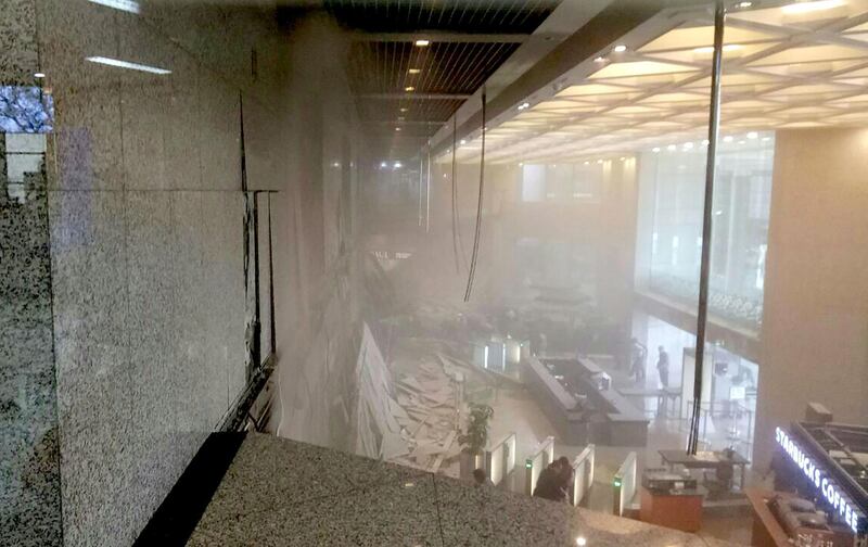 Dust still clouding the lobby after an internal balcony collapsed at Indonesia's stock exchange in Jakarta. Amailia Putri Hasniawati  / AFP