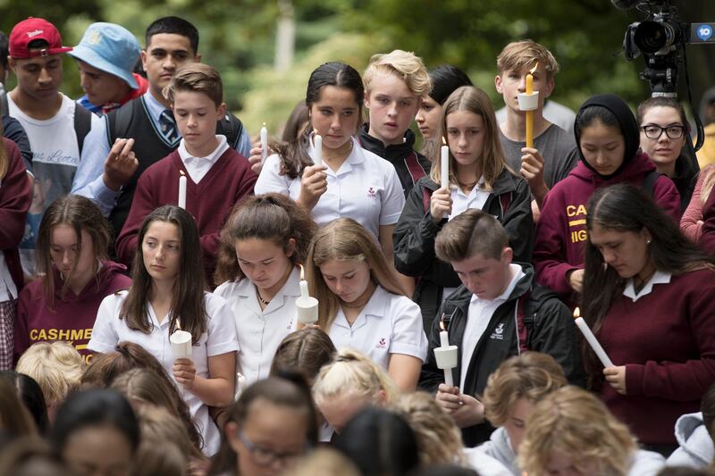 Students hold candles during a moment of silence as they gather for a vigil outside the Al Noor mosque in Christchurch. AP Photo