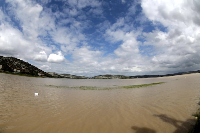 A picture taken with a fish eye lens of flood water caused by rain in the northern West Bank village of Sanour near the west bank city of Jenin. EPA