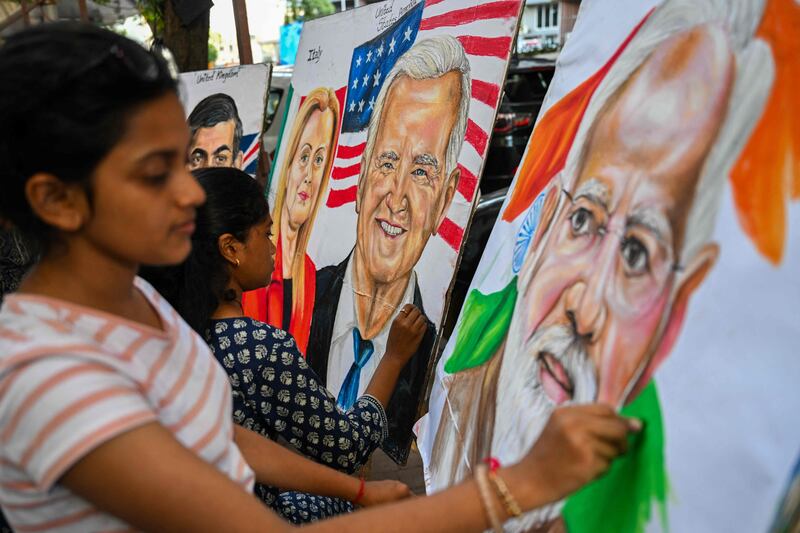 Students give final touches to paintings of US President Joe Biden, Indian Prime Minister Narendra Modi, and Italian Prime Minister Giorgia Meloni at an art school in Mumbai, ahead of the two-day G20 summit in New Delhi. AFP