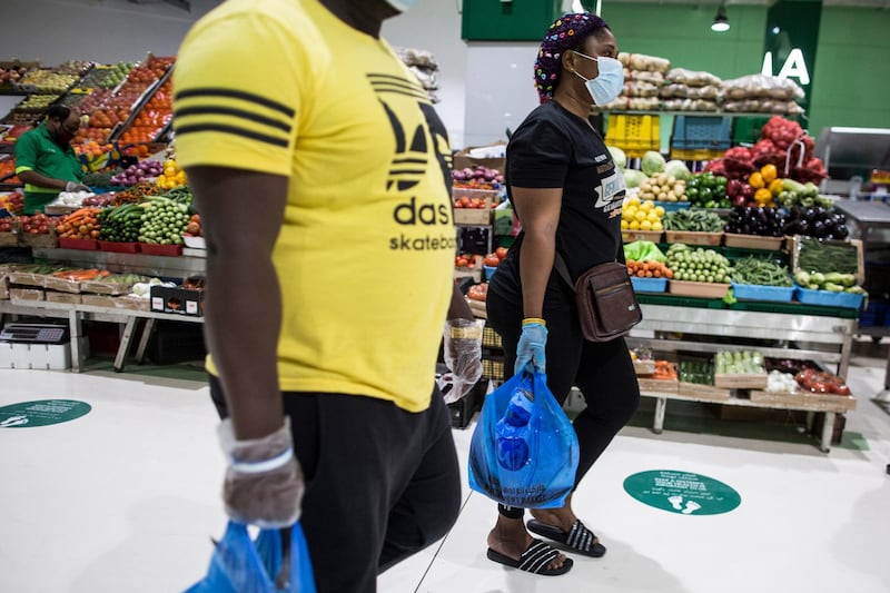Customers wearing protective masks at the vegetables market in Dubai. The Dubai authorities reopened some fish, meat and vegetables markets to the public after they were closed weeks ago to limit spread of the covid-19 coronavirus.  EPA
