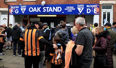 Fans arrive at Kenilworth Road's iconic Oak Stand. PA