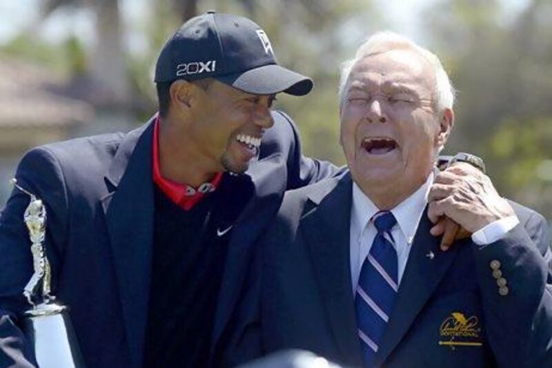 Tiger Woods, left, and Arnold Palmer share a laugh during the trophy presentation after Woods won the Arnold Palmer Invitational golf tournament in Orlando, Fla., Monday, March 25, 2013. (AP Photo/Phelan M. Ebenhack) *** Local Caption *** APTOPIX Bay Hill Golf.JPEG-09bc7.jpg
