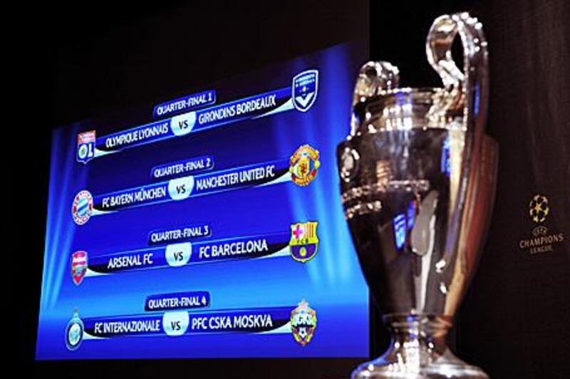 The Champions League trophy, right, with the draw for the quarter-finals of the competition.