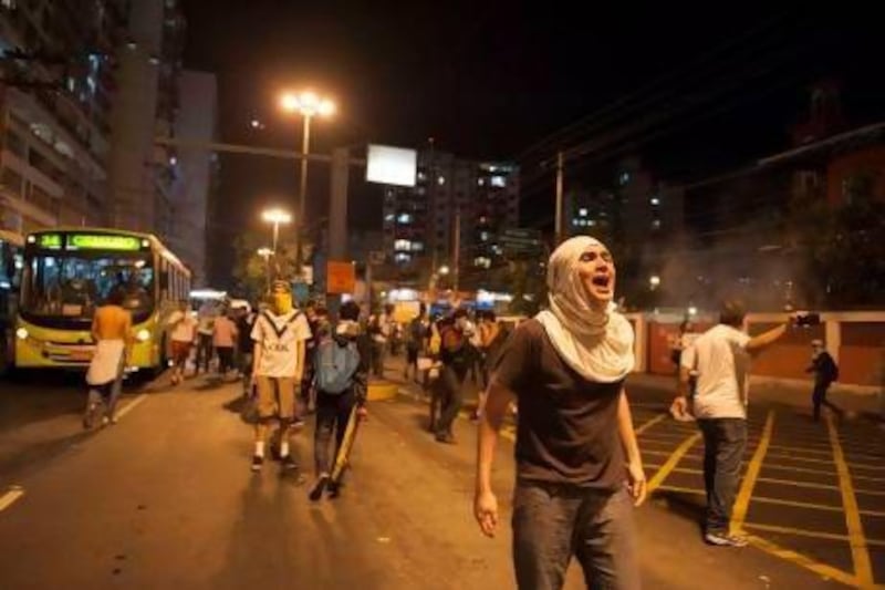 A protester shouts during an anti-government protest in Rio de Janeiro's sister city, Niteroi, Brazil.