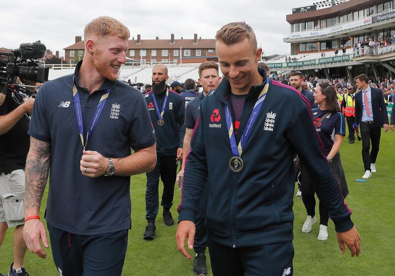 England's Ben Stokes, left, celebrates with supporters at the Oval in London one day after his team won the Cricket World Cup. AP Photo