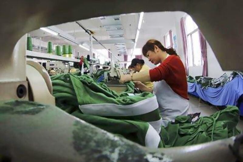 Workers at a garment factory in China's Jiangxi province. The country's per hour labour costs have risen more than 60 per cent since 2009. AP Photo