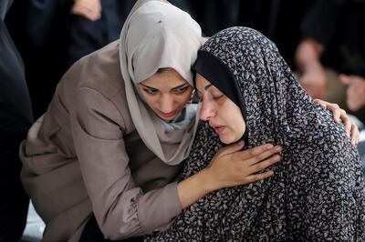 Mourners at the funeral of Palestinians killed in Israeli strikes in Rafah, in southern Gaza. Reuters 