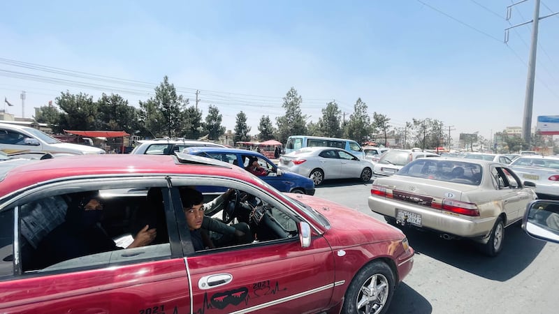 Afghan families flee Kabul on August 15, 2021. The Taliban said they do not intend to enter Kabul 'by force or war, but to negotiate with the other side to enter peacefully". Getty Images